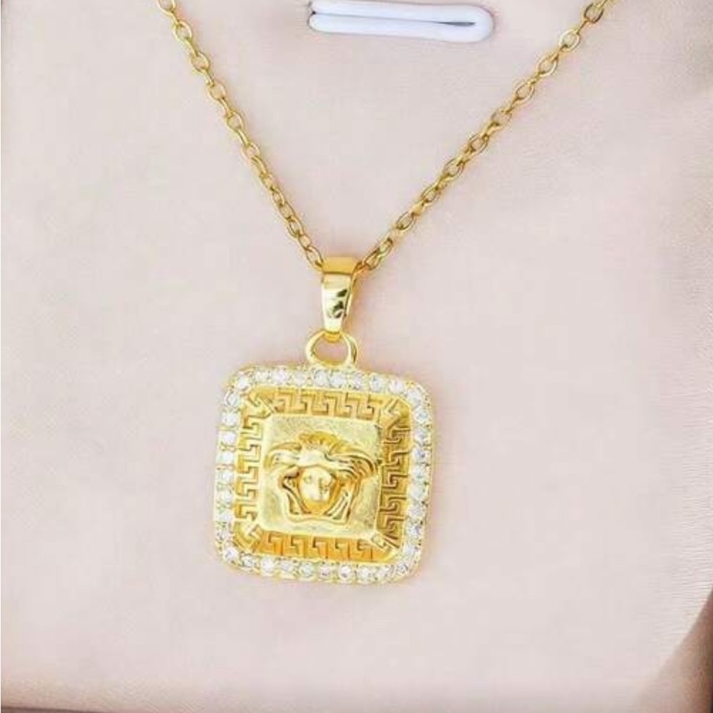 Medusa rhinestone gold tone necklace